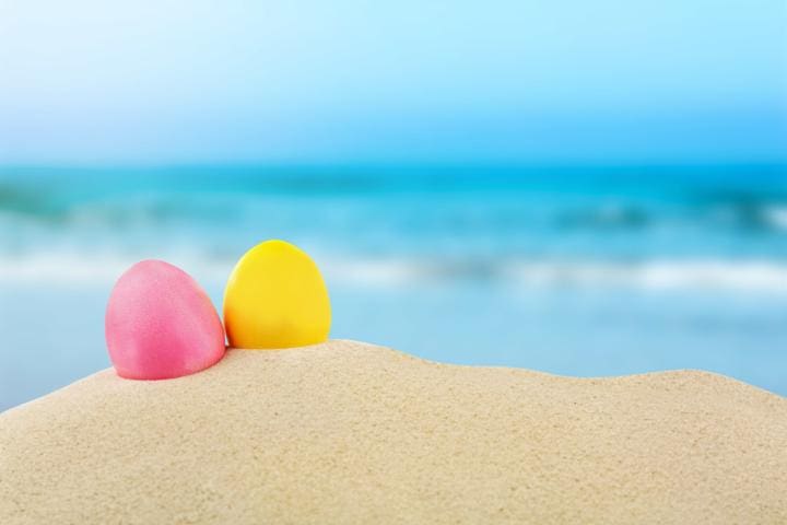 Easter eggs with sand, on white background | Beach Condos in Destin #