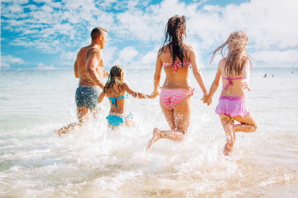 happy vacation rental guests at the beach