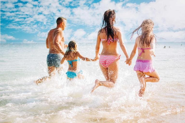 | Beach Condos in Destin happy vacation rental guests at the beach